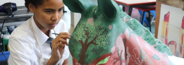 Student painting model donkey